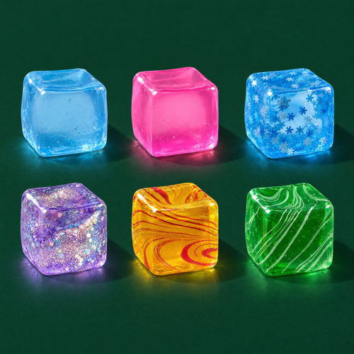 Six Crystal Ice gel cubes: solid blue and pink, snowflake blue, glitter purple, marbled orange and green