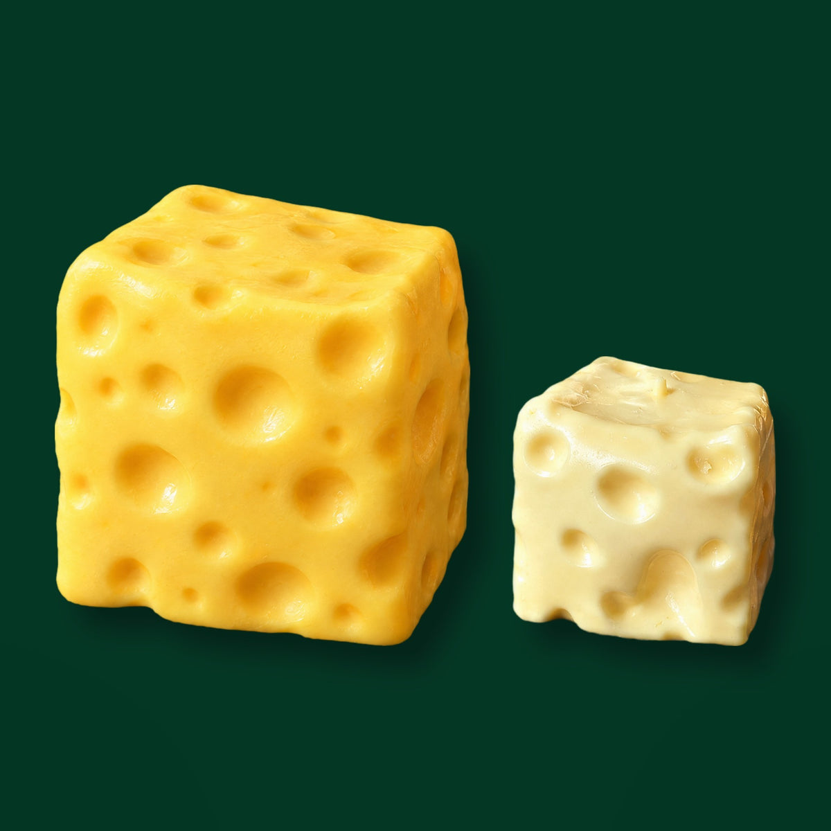 The Jumbo Cheese next to The Dent Cheese at true scale: about 11 cm across against about 7 cm