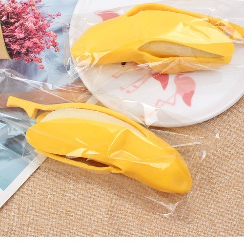 Real supplier photo: banana squishies with the peel closed, each sealed in its own clear plastic bag