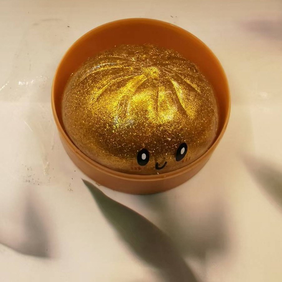 Real supplier photo of the gold Sparkle Bao in its steamer cup