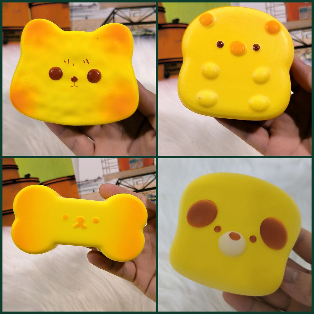 Real photos of the face toast squishies held in a hand: cat, piggy, bone and dog