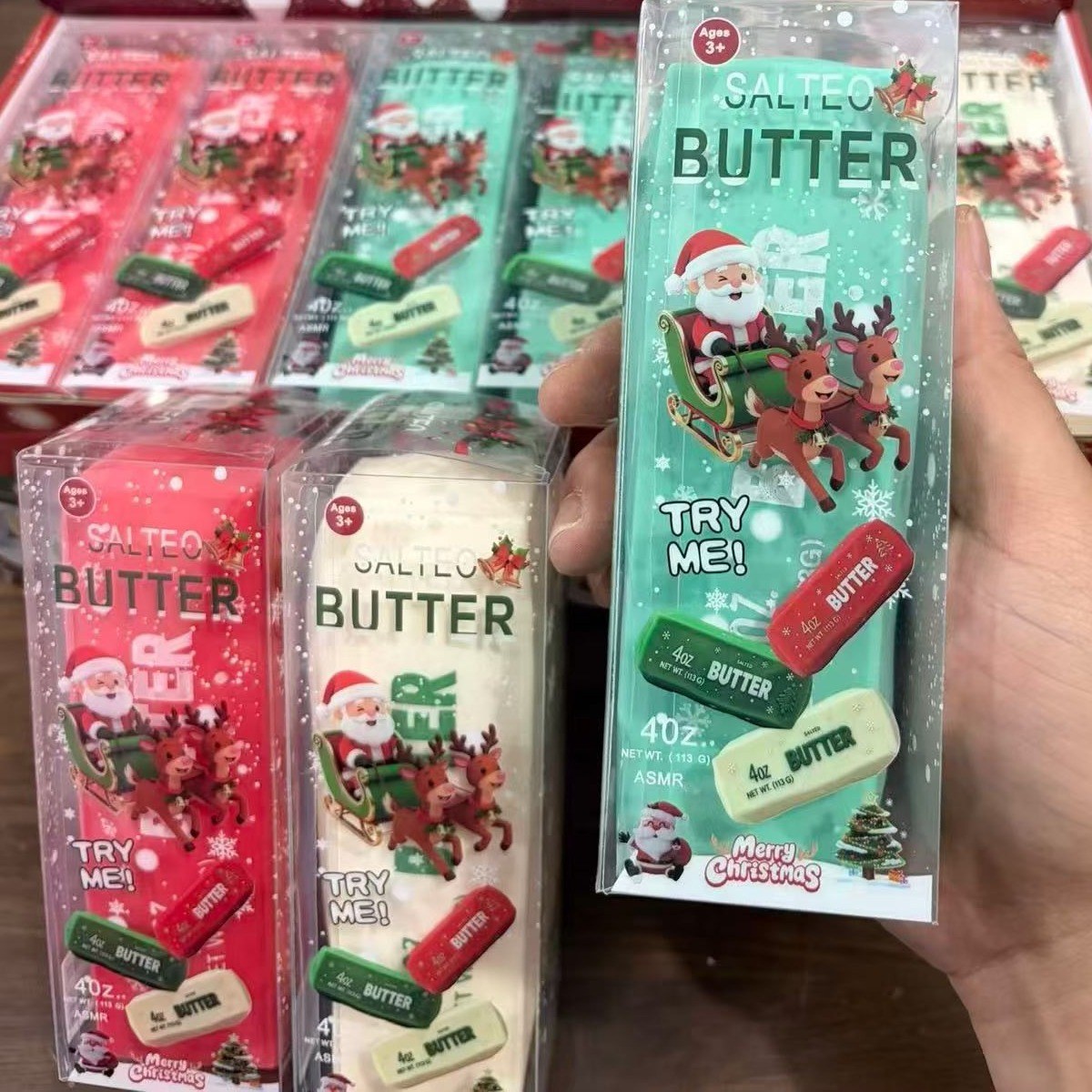 Real photo: Christmas edition in red, cream and green, each in its own clear printed box, as it ships